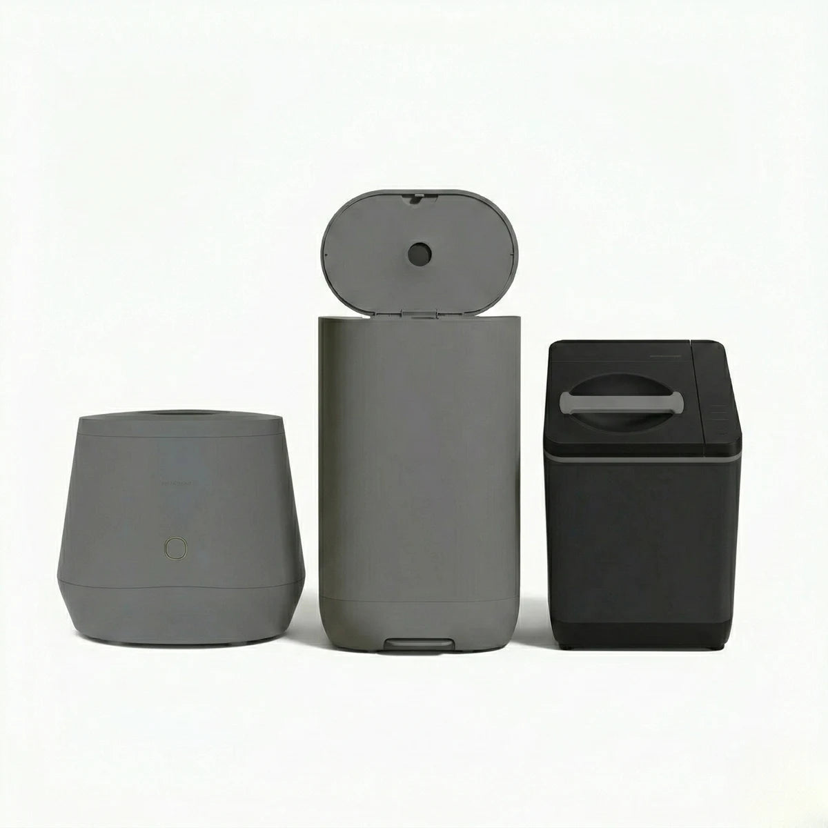 Three kitchen food-waste appliances on a light background