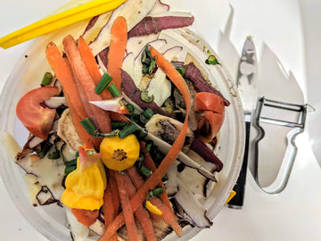 Vegetable peels and food scraps ready to be added to a countertop composter