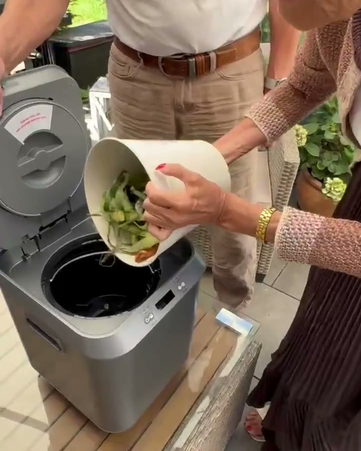 Real household footage: adding food scraps, closing the lid, using the output in the garden, the couple seated together, and their garden